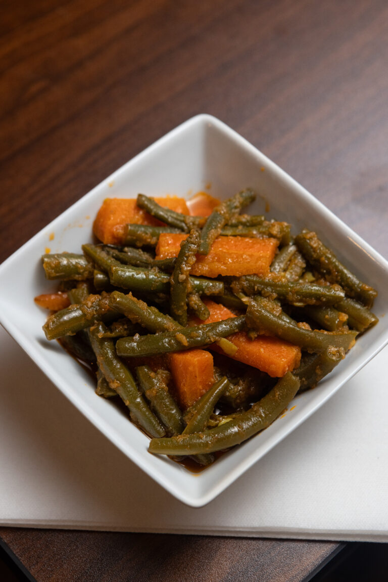 Fassolia - Fresh string beans and carrots stir fried in garlic and light tomato sauce.