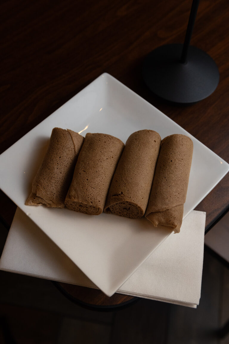 Injera - Ethiopian flatbread made from fermented teff. A staple in meals and naturally gluten-free.